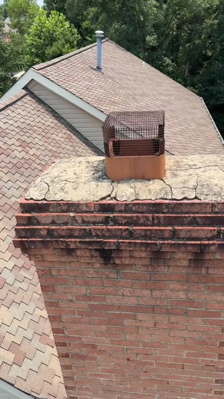 Weathered brick chimney crown and rusted cap before repair in Northern Virginia — gallery frame 1