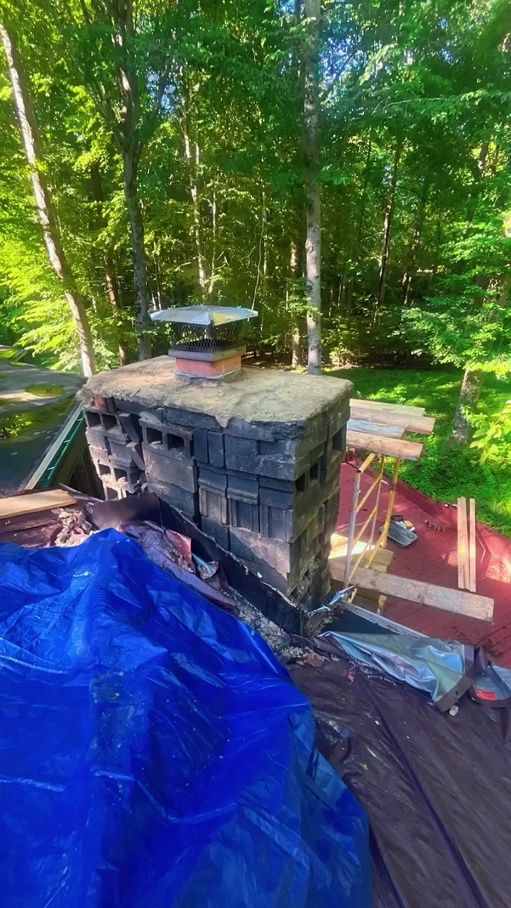 Worn stone chimney cap and masonry before a repair conversation — mobile service overview